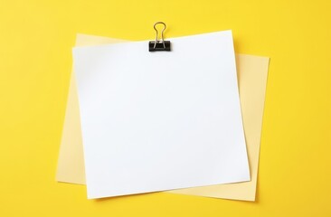 a white blank sheet of paper on a yellow background