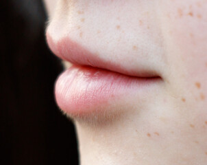 Fototapeta premium A close up of a woman's face with a pink lip