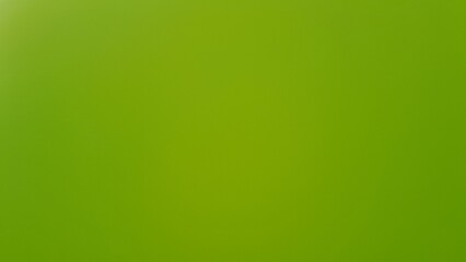 Obraz premium A simple,solid green background with blurry gradient