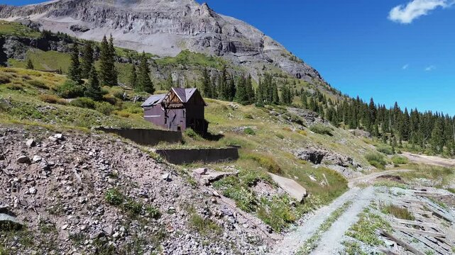 Upper Camp Bird Mine near Ouray, Colorado. Abandoned, idle mine in a high alpine setting is featured in the flyover shot of the area.