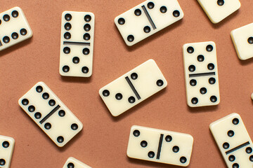 Dominoes bones on brown background	