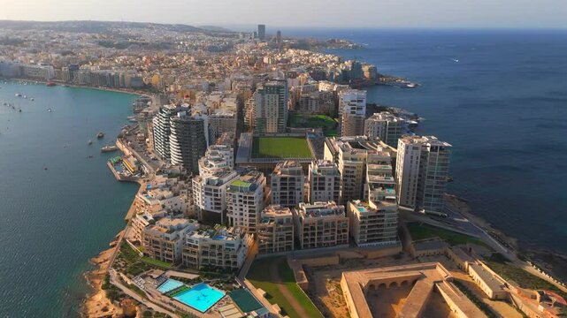 Discover Sliema&rsquo;s breathtaking waterfront in this captivating drone video. Soar over the sparkling Mediterranean Sea and admire the stunning architecture and lively atmosphere of this coastal gem.
