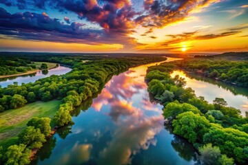 Fototapeta premium Serene Landscape of the Texas Red River with Lush Greenery and Tranquil Water Reflections at Sunset