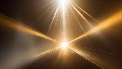 Sunlight breaking through a dense fog on a quiet road at sunrise reflecting golden hues across the surface