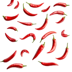 Falling red hot chili peppers isolated on white background, selective focus