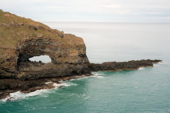 Hole in the Rock at Akaroa Head Scenic Reserve Cliffs - Natural Coastal Formation