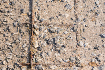 Rugged Urban Texture: A Close-Up View of Weathered Concrete and Corroded Rebar