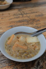 Mung bean porridge, or often shortened to burjo (bubur kacang hijau), is an Indonesian sweet porridge made from mung beans, coconut milk, and palm sugar or cane sugar.