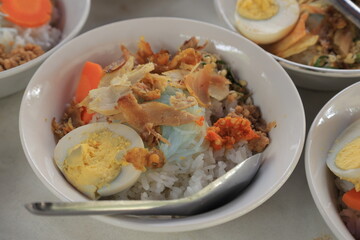 Soto ayam is a typical Indonesian food in the form of a kind of chicken soup with a yellowish gravy