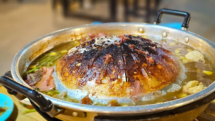Burnt Pan, Close up of burned Thai grilled BBQ pan. Pan is full of foods stains Carcinogen and...