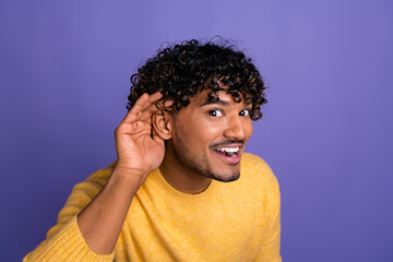 Photo of funky funny man wear trendy yellow clothes palm arm ear listen communication isolated on...
