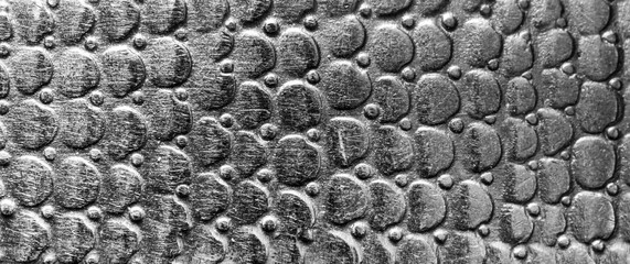 Scratched metal texture with round pattern. Abstract background of steel. Banner.