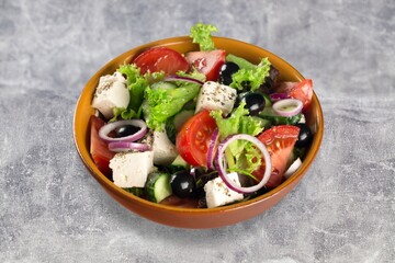 Colorful tasty fresh salad dish in bowl