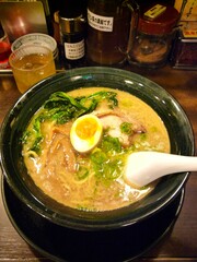 a delicious BBQ pork Japanese ramen in thick pork broth in a Japanese restaurant