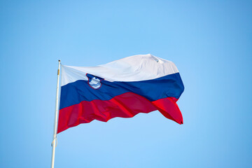Slovenian flag on blue sky