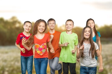 Fototapeta premium Happy kids, friends play outdoor in nature