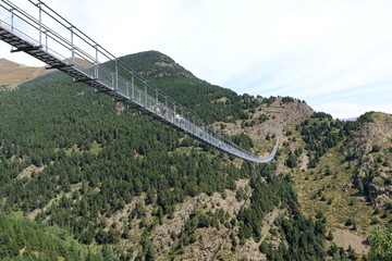 Canillo, Andorra, Europe - August 29 2024: people walking on the longest Tibetan bridge in Europe