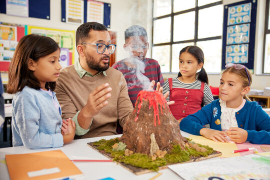 Primary students learning volcanic eruption during geography class
