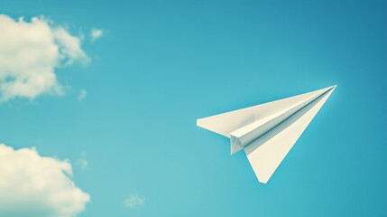 Isolated paper airplane on a clear blue sky background.
