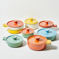 A set of colorful ceramic cookware with lids, arranged on a white background.