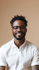 Fototapeta premium A man with a beard and glasses is smiling for the camera