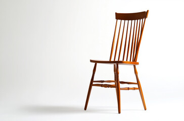 a windsor chair with a wooden frame and spindle back
