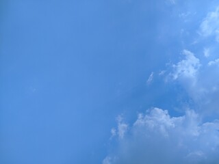 A serene blue sky with wispy white clouds drifting lazily, creating a peaceful and calming atmosphere. Perfect for nature-themed projects.