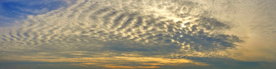  Panoramic photo of sunset sky. Sky with colorful clouds.