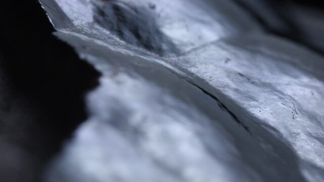 Raw iron ore extreme futuristic close up. Rotation movement