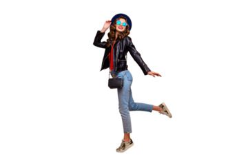 Full length photo of cute lovely lady enjoy her free time on stroll in autumn fall wear black leather jacket denim jeans isolated over yellow color background