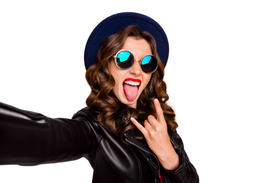 Close up photo of cheerful girl blogger influencer on rock-and-roll heavy party make selfie show horns symbol wear black leather jacket isolated over yellow color background