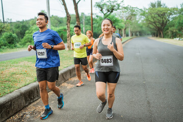 asian athlete activity joining marathon competition in park
