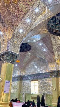 Samarra, Iraq - 9 November 2022: Interior and shiite muslim women inside Golden Mosque Imam Ali Hadi in Samarra. Vertical