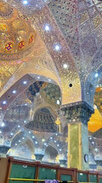 Samarra, Iraq - 9 November 2022: Interior and shiite muslim women inside Golden Mosque Imam Ali Hadi in Samarra. Vertical