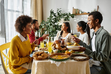 A group of friends enjoys delicious dishes while celebrating Thanksgiving in a warm setting.