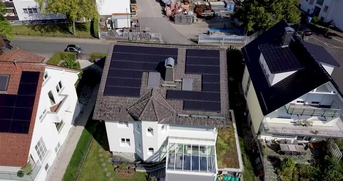 Aerial drone view of solar panels installed on houses and barns in germany during summer