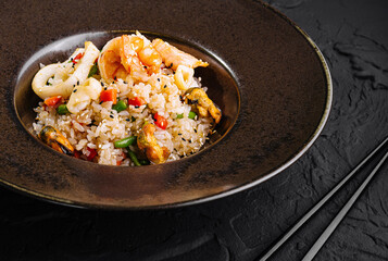 Gourmet asian fried rice dish on elegant tableware