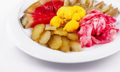 Pickled vegetables plate presenting colorful variety of fermented food
