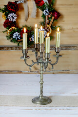 Vintage candle holder on the table. Christmas decorations.