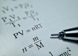 Macro photography of pen and book