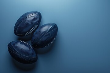 Three dark blue rugby balls arranged on a blue background
