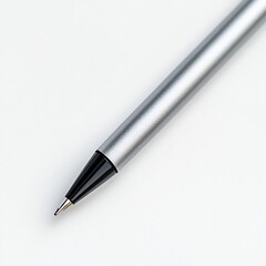 Pen cap removed, tip exposed, close-up from a diagonal angle, white background