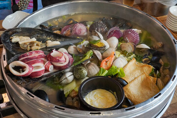 Seafood soup with clams and squid