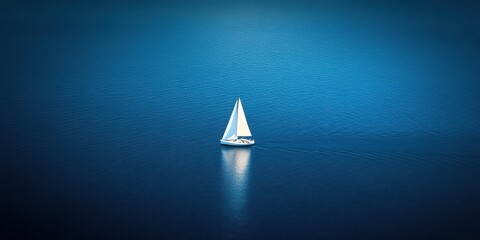 Fototapeta premium Serene Sailboat on Calm Blue Waters