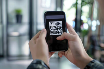 Scanning QR code on smartphone screen.
