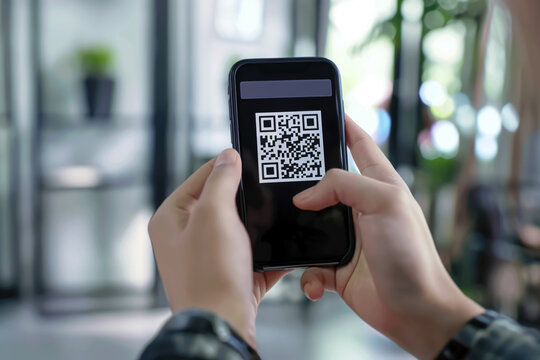 Scanning QR code on smartphone screen.