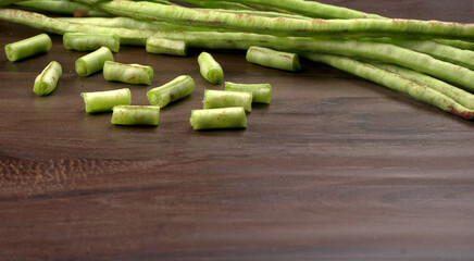 French beans with stewed green peas on wooden background. Healthy food concept.