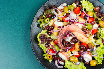 Exclusive salad with octopus, greens and vegetables.
