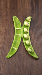 Pile of green beans over wooden background, Healthy food concept
