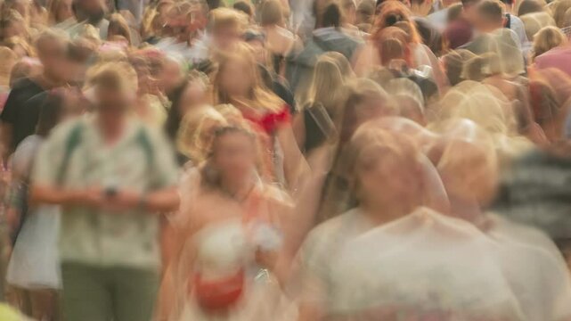 Close-up time-lapse unrecognizable blurry huge crowd of people crossing city street, busy crossroad fast motion, many pedestrians walking crosswalk. Rush hour crowded, people walk, blurred faces